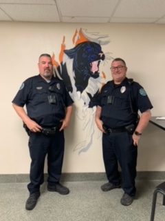 Officer Mark Evans and Officer Scott Davis in front of panther.