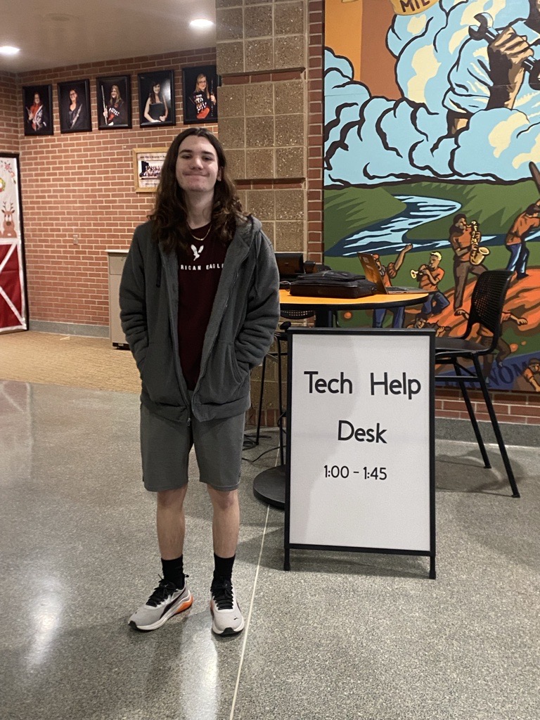 Senior Miles Brown staffs the tech help desk