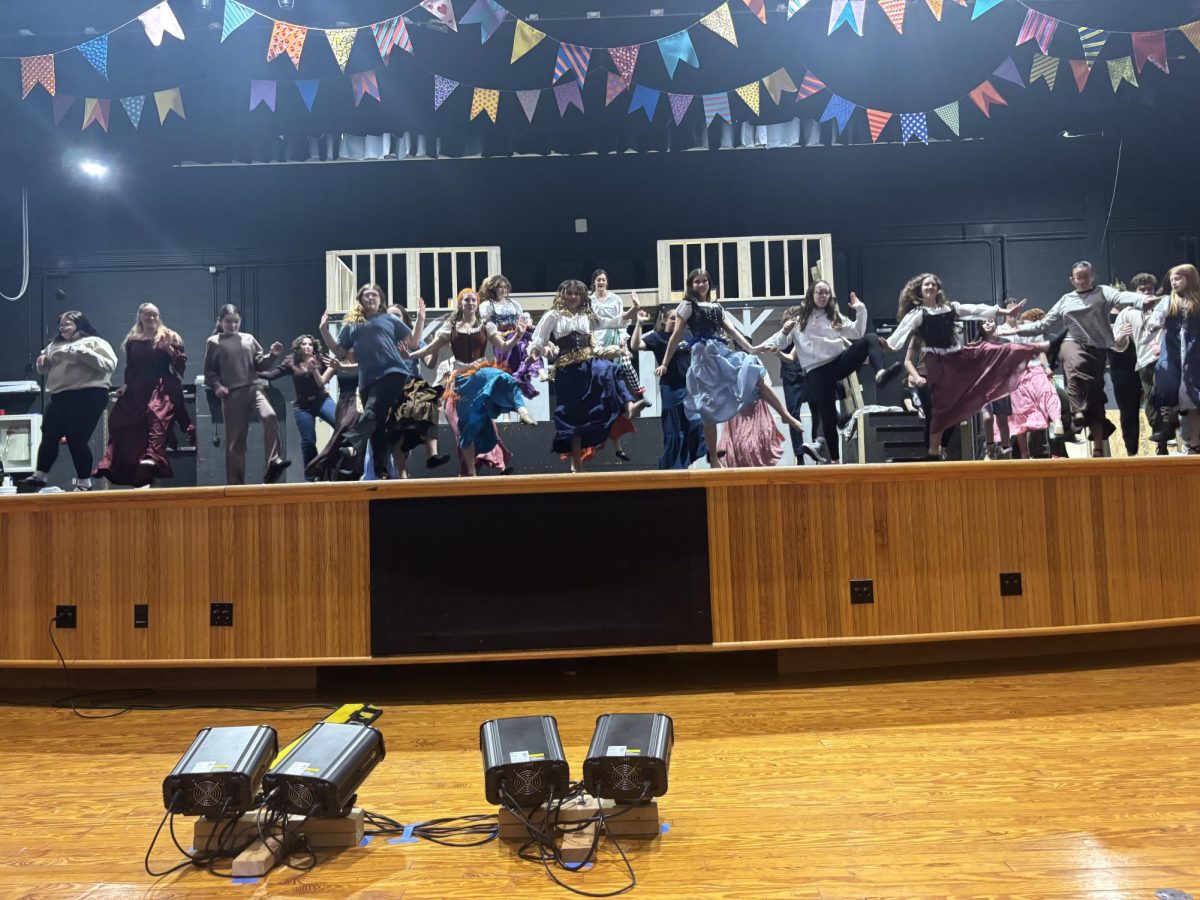 While the cast of The Hunchback of Notre Dame performs, the stage crew makes sure everything is in order.